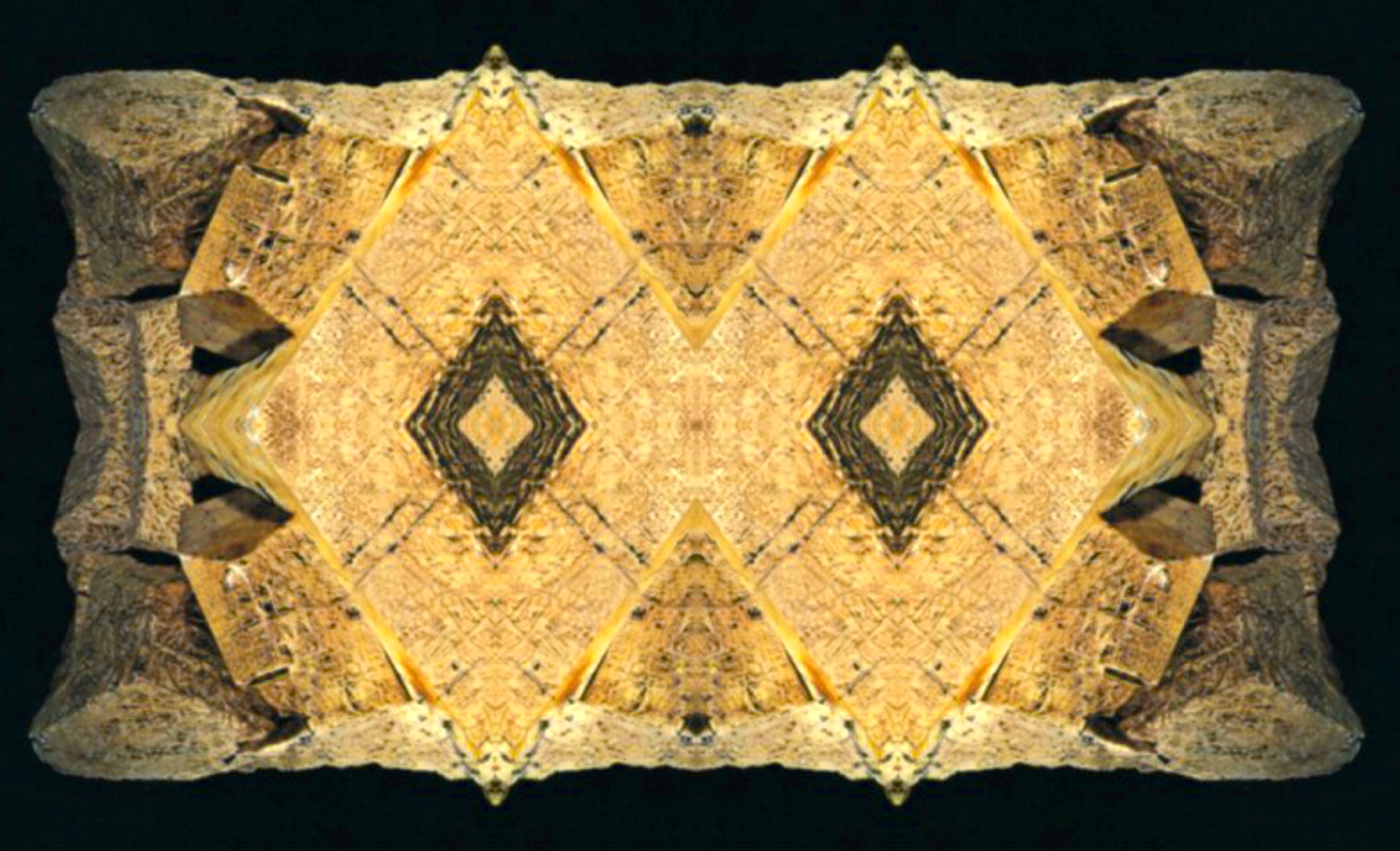 mirrored yellow trianglar shapes, either wood or clay tablets